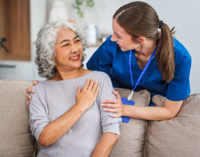 caregiver looking at elderly
