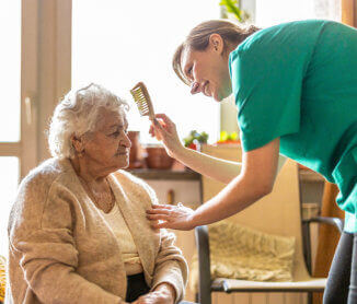 nurse combing elder