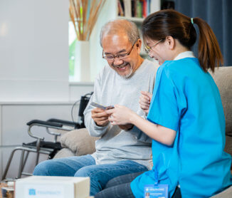 nurse helping elder to take medicine