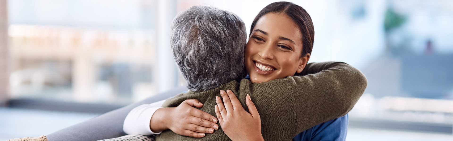 nurse hugging a woman
