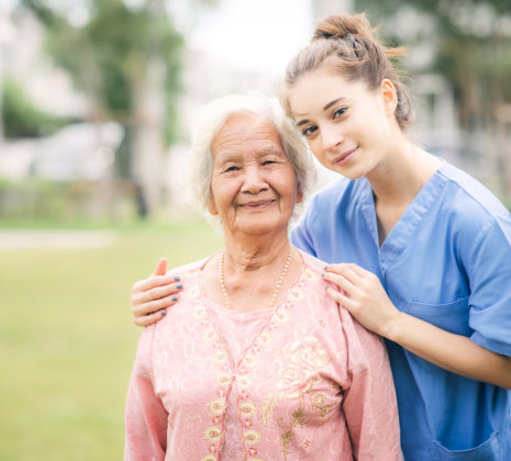 nurse and senior smiling
