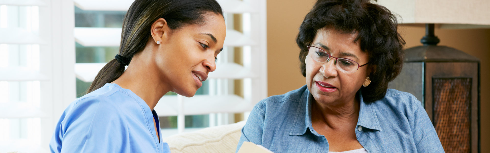 senior talking to nurse
