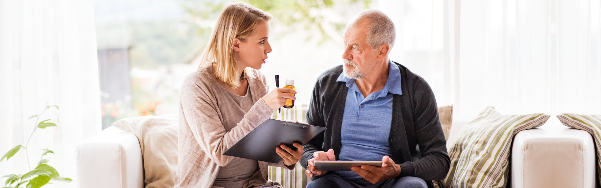 nurse talking to elder man